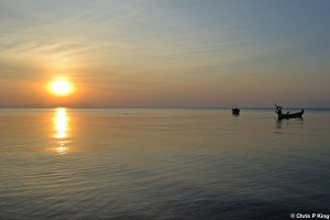Sunset on Calm Sea with Boats Rabbit Island (Koh Tonsay) Cambodia