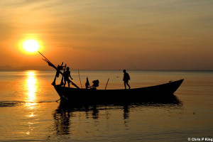 Sunset with boys on a Boat Rabbit Island (Koh Tonsay) Cambodia